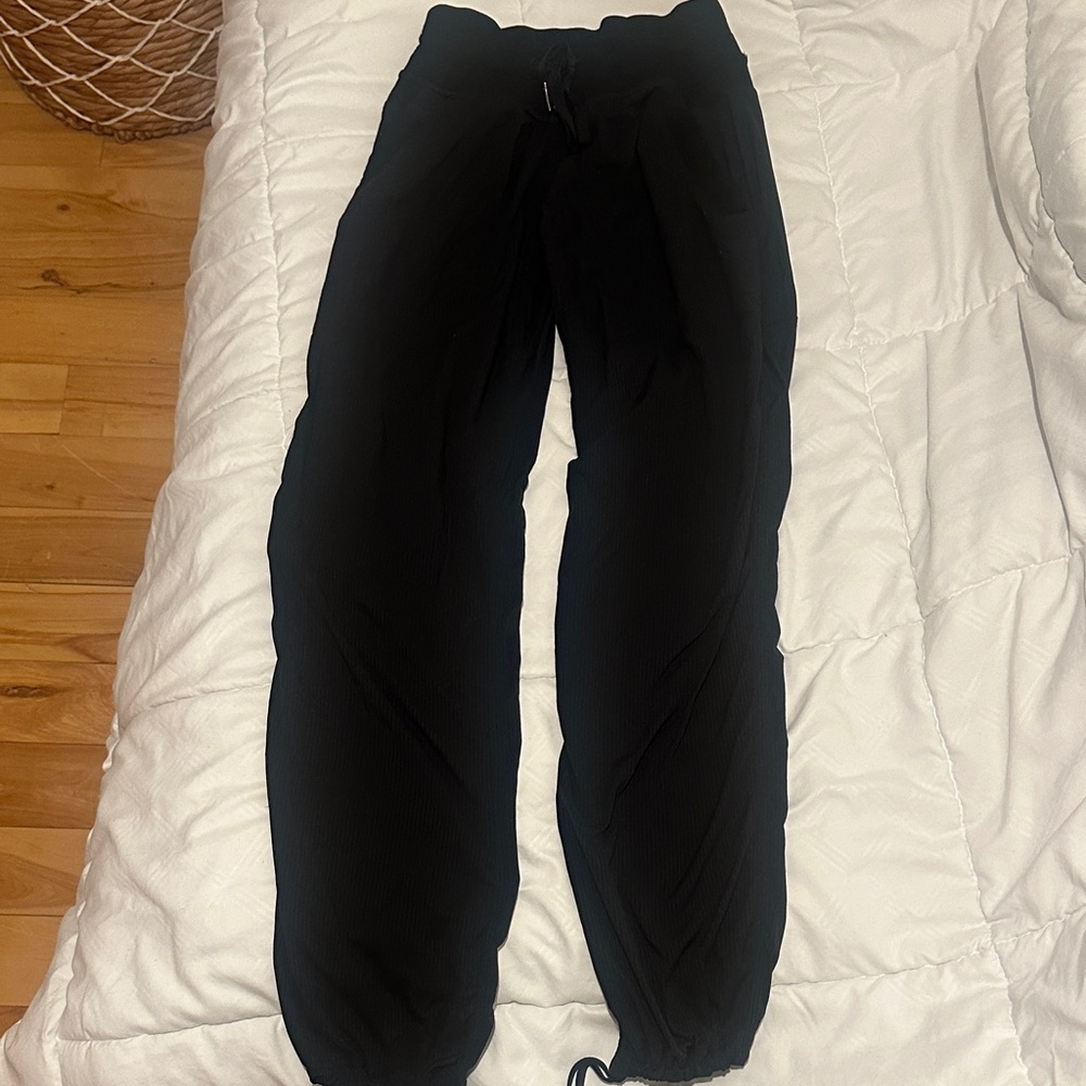 Black woman Lululemon studio pants